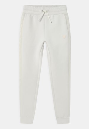 Pantalon de jogging blanc avec taille élastique et cordon, poches latérales, poignets côtelés et logo discret sur la cuisse gauche.