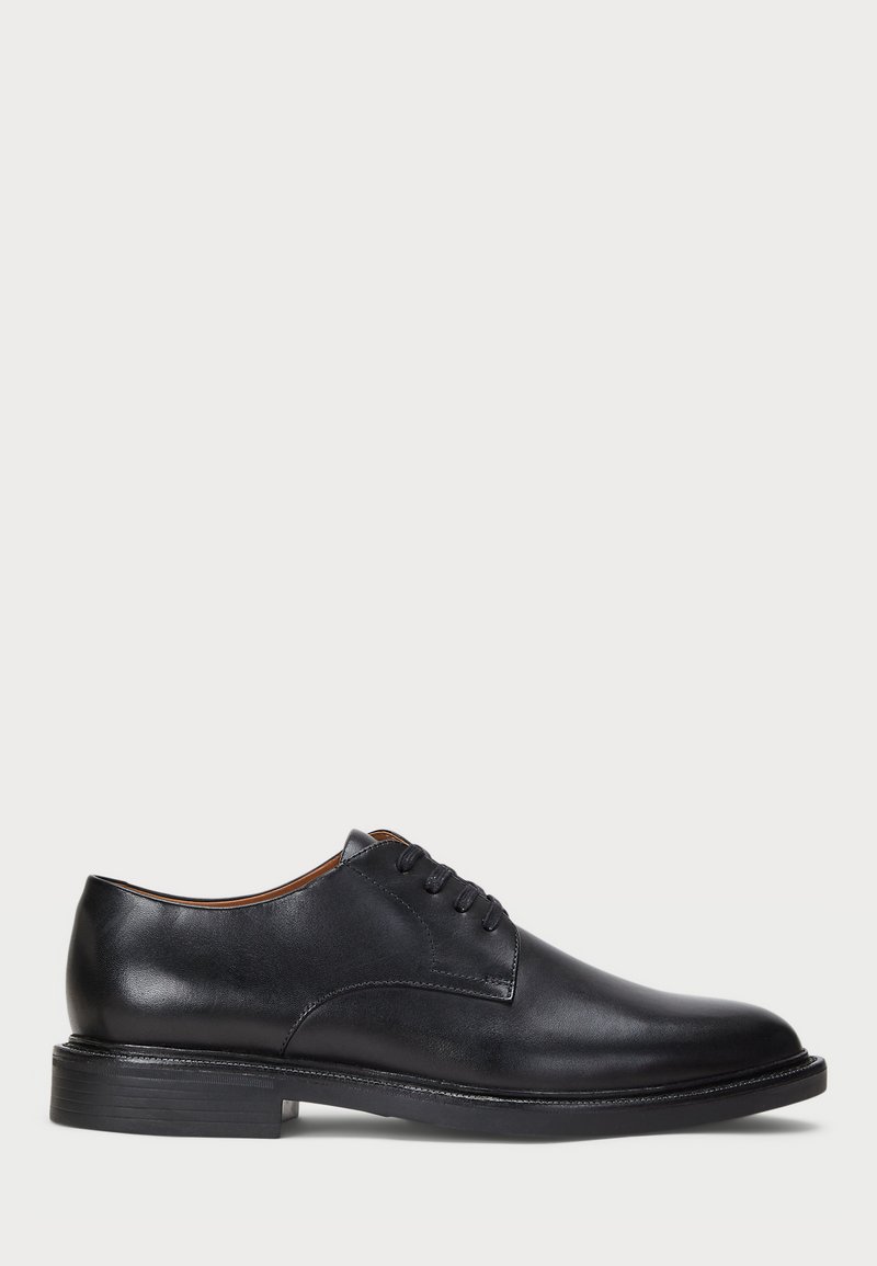 Black leather dress shoe with a round toe, lace-up design, and a low stacked heel. Smooth texture with minimal stitching details.