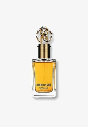 Roberto Cavalli Signature parfume i en klar, rektangulær glasflaske med et gyldent, udsmykket låg og en amberfarvet væske indeni.