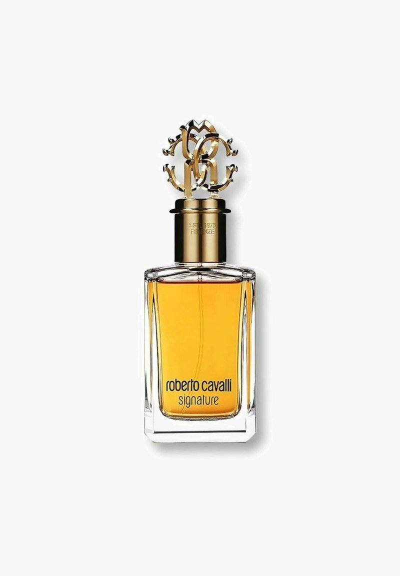Roberto Cavalli Signature parfym i en klar rektangulär glasflaska, med ett guldornamenterat lock och ambra-färgad vätska inuti.