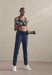 adidas Sportswear ESSENTIALS SMALL LOGO FEEL COZY OPEN HEM PANT - Calças de fato de treino - legend ink