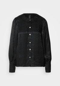 Blouse noire avec un motif léopard texturé, dotée d'un col rond orné de fleurs et de boutons carrés sur le devant. Manches longues.