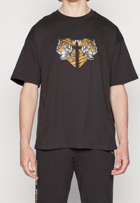 Puma Triko s potiskem - black