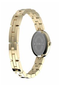 Cinturino in metallo dorato con chiusura, attaccato a una cassa rotonda del orologio che mostra il logo Timex inciso sul retro in acciaio inox.