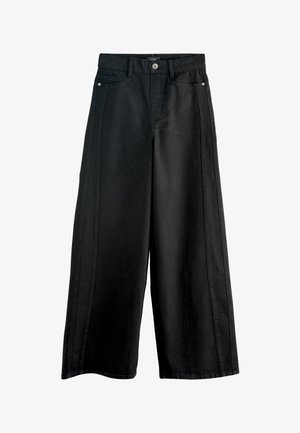 Črne široke kavbojke z visokim pasom, ki imajo sprednje žepke, gumbasto zapiranje in kontrastno šivanje ob stranskih šivih.