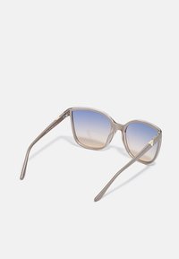 Guess Sončna očala - shiny beige / blu mirror