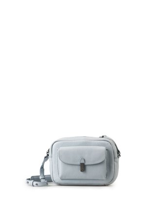 Light blue small crossbody bag with front pocket, flap closure, and adjustable strap on white background.