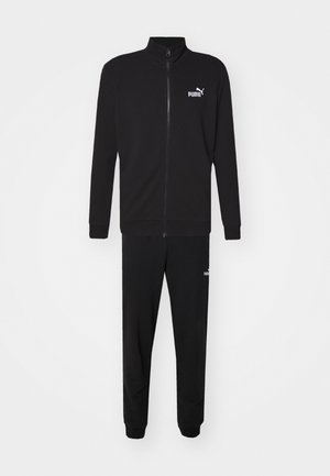 Black tracksuit with a zip-up jacket and jogger-style pants. Made of smooth fabric, featuring a white logo on the chest and thigh.