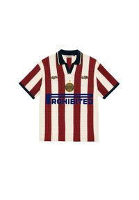 Chemise à manches courtes avec des rayures verticales rouges et blanches, col et poignets bleu marine, et texte "PROHIBITED" avec logos sur la poitrine.