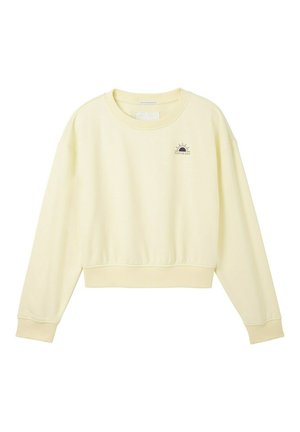 Sudadera corta de color amarillo claro, con cuello redondo, mangas largas y un diseño gráfico de un sol con la frase "DÍAS POSITIVOS" en letras oscuras.