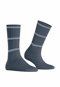 Calze a coste blu scuro con due strisce orizzontali azzurre, dal materiale morbido e con punta e tallone rinforzati per una maggiore resistenza.