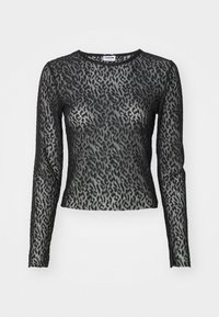 Långärmad topp i svart spets med leopardmönster, med rund halsringning och figurnära silhuett, som visar upp texturerad detalj.