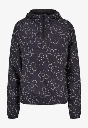 Jachetă neagră rezistentă la apă, cu un model floral alb minimalist, cu fermoar pe jumătate în față, glugă ajustabilă și manșete elasticate.