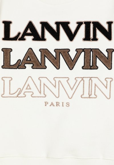 Fehér pulóver nagy, fekete, barna és bézs hímzett "LANVIN" felirattal, alatta kisebb bézs betűkkel a "PARIS" felirat.