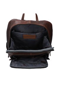 Brown leather backpack with a zippered closure. Interior features gray fabric lining and multiple pockets for organization.