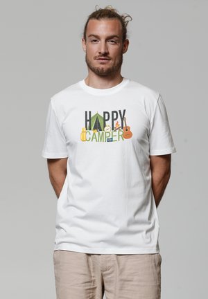 White cotton t-shirt featuring the text "HAPPY CAMPER" in colorful designs, including a camping tent and various outdoor icons.