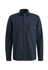Chemise bleu foncé à manches longues, boutonnée, col et poche poitrine zippée avec une petite étiquette.