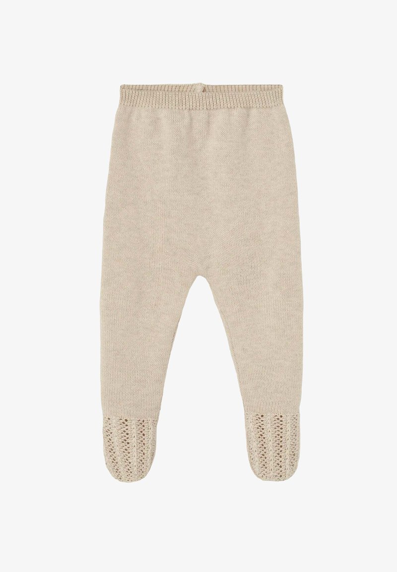 Leggings en tricot beige avec une taille côtelée et des accents en dentelle imprimée au niveau des pieds. Texture douce, design de jambe fuselée.