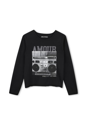 Chemise noire à manches longues avec un graphisme de boombox en noir et blanc et les mots "AMOUR" et "ZADIG ET VOLTAIRE" sur le devant.