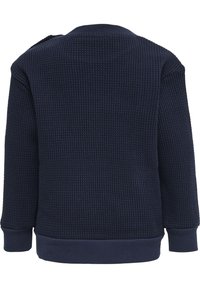 Mörkblå sweatshirt tillverkad av texturerad våffelstickad tyg, med rundad halsringning och ribbade muddar och nederkant.
