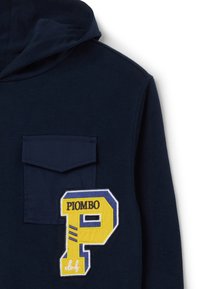 Navy blue hoodie with a front pocket, featuring a yellow and blue embroidered "P" patch and "PIOMBO" text. Soft fabric texture.