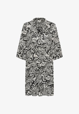 Robe noire et blanche longueur genou avec manches 3/4, un col, et un motif paisley complexe sur toute la surface.
