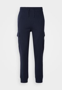 Pantalon jogger bleu marine avec taille élastique, cordon de serrage, jambes fuselées, chevilles bord-côte et poches cargo à rabat avec boutons des deux côtés.