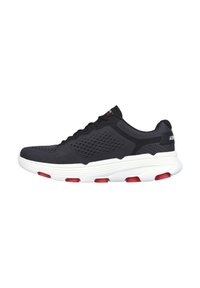 Black athletic shoe with a breathable mesh upper, white sole, and red accents. Features a rounded toe and textured detailing.