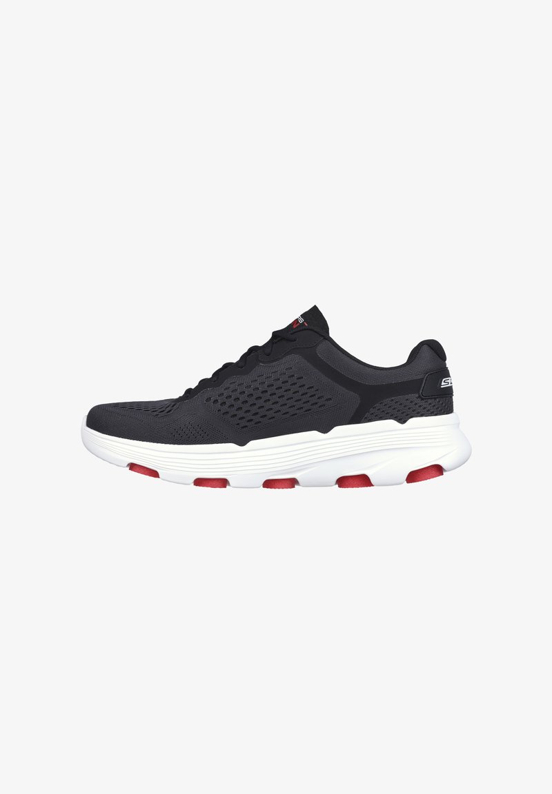 Black athletic shoe with a breathable mesh upper, white sole, and red accents. Features a rounded toe and textured detailing.