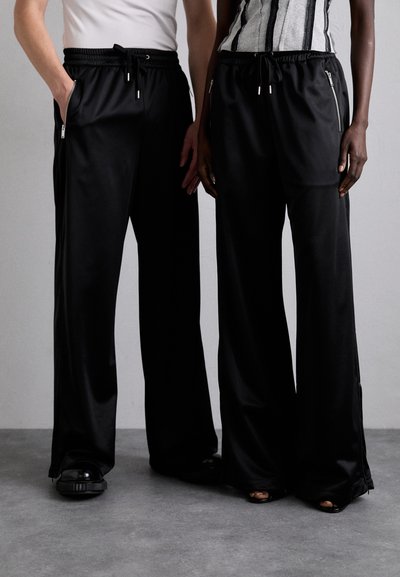 Han Kjøbenhavn OVERSIZED TRACK UNISEX - Tracksuit bottoms - black