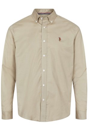 Beige shirt met lange mouwen, een button-down kraag, knopen aan de voorkant en een klein geborduurd ontwerp op de linkerborst. Gladde, lichte stof.