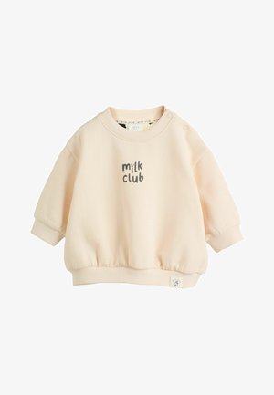 Sudadera de color rosa claro con cuello redondo acanalado, mangas ajustadas y dobladillo fruncido, con "milk club" impreso en gris en la parte frontal.