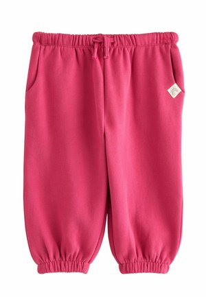 Hellpinkfarbene Sweatpants für Kleinkinder mit elastischem Bund und Bündchen, Vordertaschen und einem kleinen seitlichen Logopatch auf der rechten Seite.