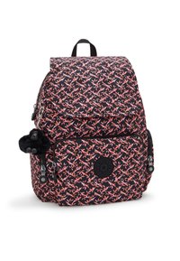 Backpack with a dark background featuring a pink floral pattern, zippered pockets, a black logo patch, and a black furry charm.