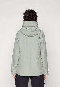 Light gray waterproof jacket with a hood, featuring a cinched waist, side pockets, and a logo on the upper back. Smooth texture.