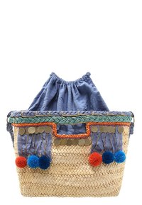 Woven straw basket with blue fabric lining, embroidered accents, and colorful pom-poms. Features metallic discs and a braided handle.