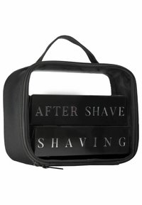 Czarna kosmetyczka na zamek błyskawiczny z dwiema czarnymi skrzynkami oznaczonymi srebrnymi literami "PO GOLENIU" i "GOLENIE". Wytrzymały materiał z uchwytem.