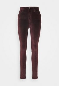 Jeans skinny de pana burdeos con una cinturilla alta, que cuentan con bolsillos delanteros y un solo botón plateado en la parte superior. Textura suave.
