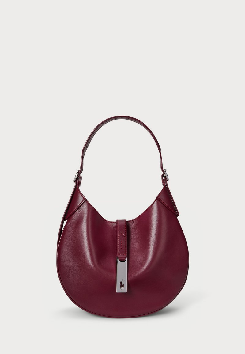 Burgundy leather hobo bag with a curved shape, short handle, and a silver-tone hardware accent featuring a logo detail on the clasp.