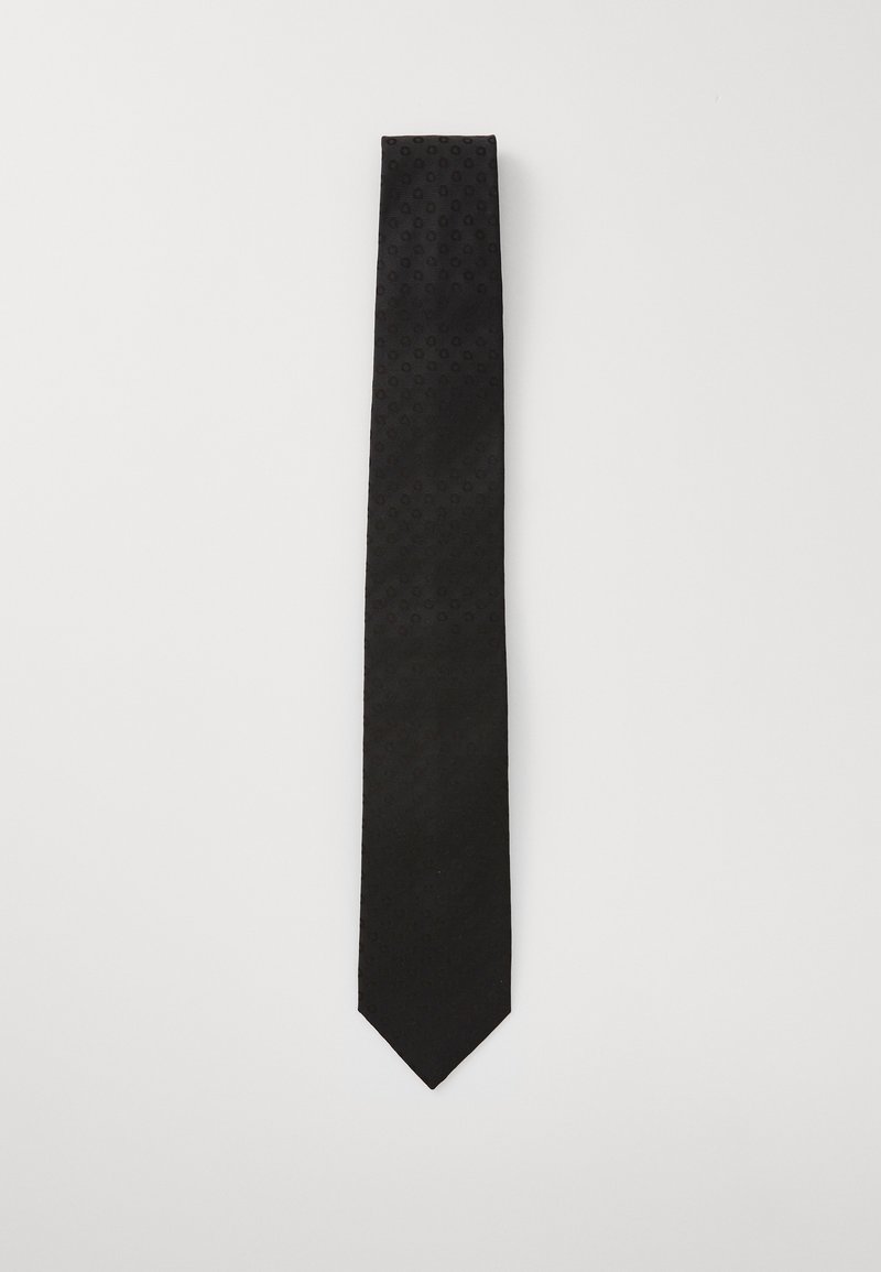 Corbata de gala hecha de una tela suave con un sutil patrón de puntos. Tiene un extremo puntiagudo y mide aproximadamente 145 cm de longitud.