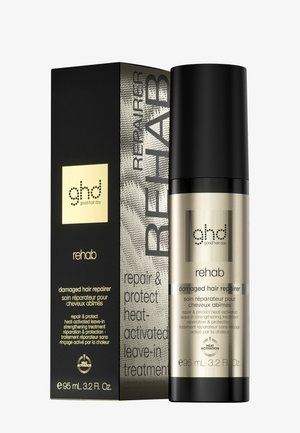 Bouteille ghd Rehab pour les cheveux abîmés et boîte noire-gold avec texte sur le traitement fortifiant sans rinçage actif à la chaleur, 95 ml.