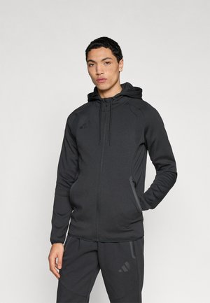 TIRO TRAVEL HOODIE - Užtrauktuku užsegamas treningas - black