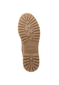 Semelle de botte en caoutchouc brun avec des rainures profondes, des crampons en forme de croix et le nom de la marque "Travelin'" embossé près du talon.