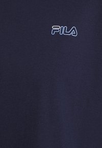 Navy blue cotton T-shirt featuring a light blue FILA logo, smooth texture, and a classic crew neck design.