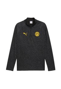 Camiseta de entrenamiento negra de manga larga con un patrón texturizado, cuello con cremallera, logotipo amarillo de Puma y escudo del BVB en el pecho.