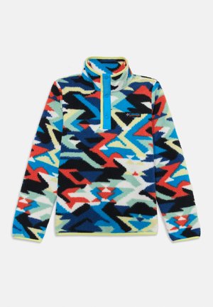 Pull en polaire avec un motif zigzag multicolore, doté d'un col à demi-zip et d'une patte de boutonnage bleue contrastante. Tissu doux et texturé.
