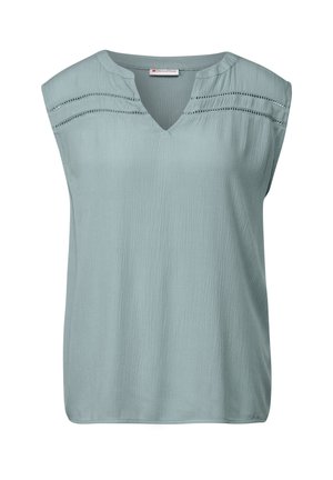 Haut sans manches bleu clair avec un décolleté en V, un tissu texturé et une couture horizontale décorative près de l'épaule. Fini lisse.