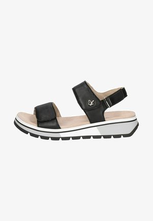 Black leather sandal with two adjustable straps, padded insole, white and grey sole, and textured tread for traction. Features a logo detail.