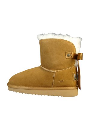 Botte de cheville en daim tan avec bordure en fourrure, accent de nœud sur le côté et semelle en caoutchouc. Présente une texture lisse et un design à bout rond.