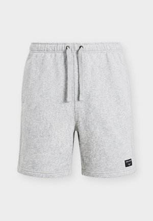 Light grey casual shorts with elastic waistband, drawstring closure, side pockets, and a small black brand label on the lower left hem.